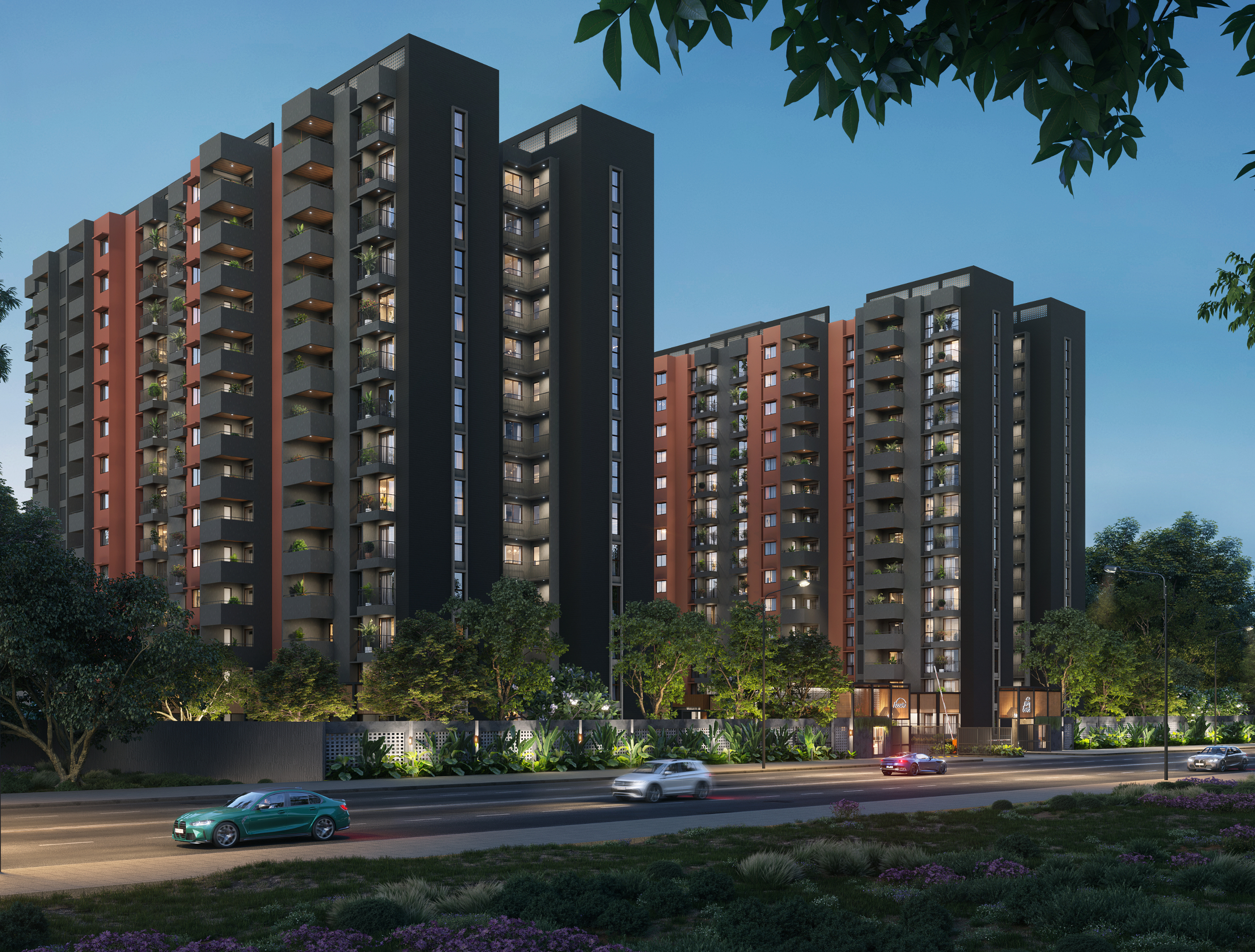 Aerial view of modern apartment towers surrounded by lush greenery and nearby roads